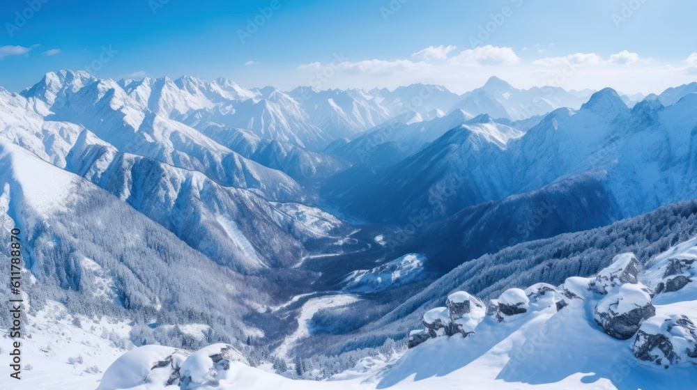 Obraz premium Serene mountain range covered in snow, with a breathtaking view of the valley below