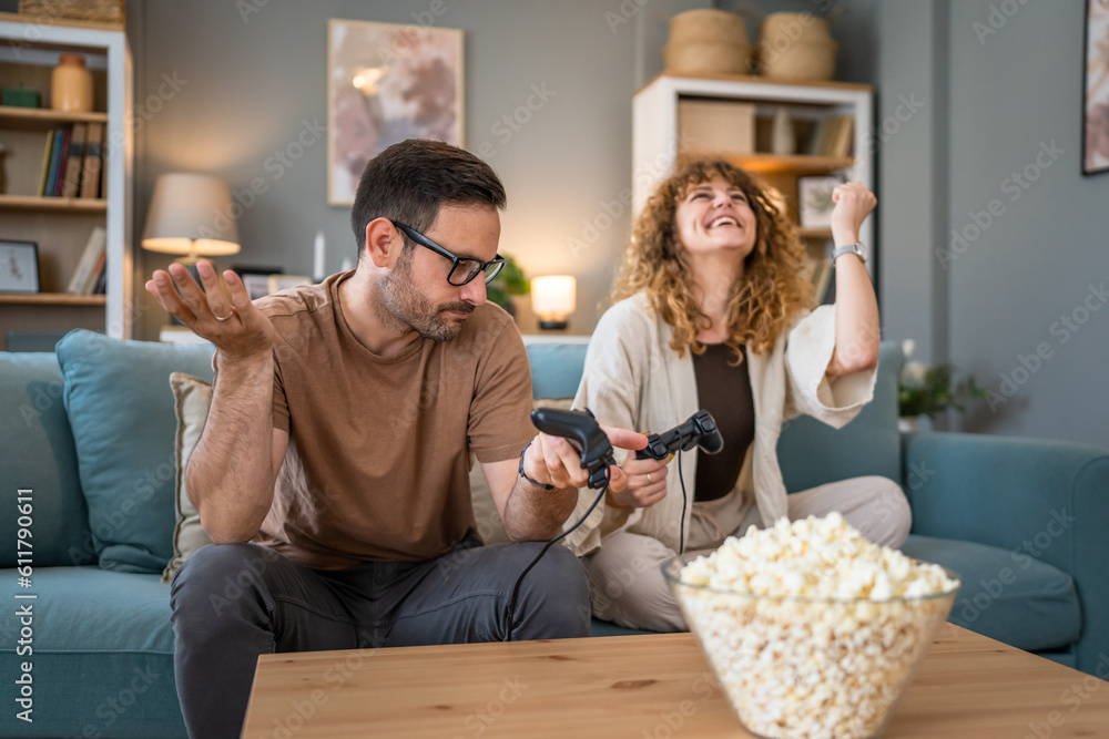 couple man and woman husband wife play console video games at home couple man and woman husband wife play console video games at home