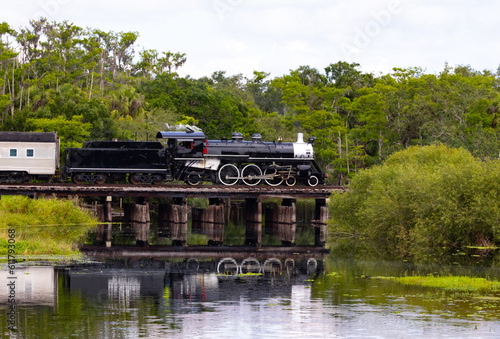Fotografie, Obraz Steam train crossing a train trestle