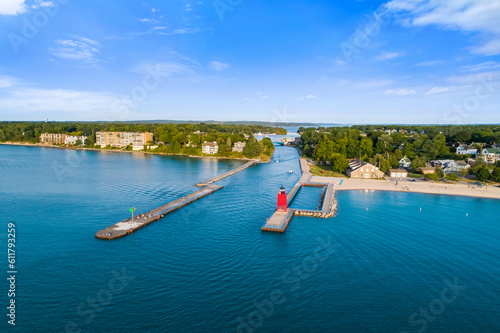 Wallpaper Mural Aerial drone photograph of serene river inlet from Lake Michigan into Charlevoix harbor under a vivid afternoon blue sky, reflecting on gently rippled turquoise water bordered by lush green shorelines Torontodigital.ca
