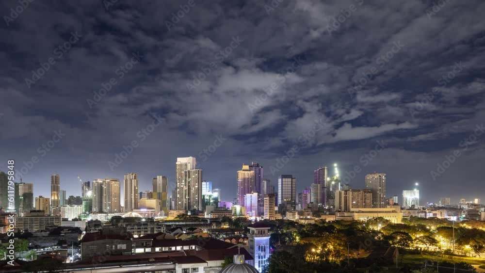 Time lapse of the clouds moving above the buildings in Manila, Philippines. Time lapse of the clouds moving above the buildings in Manila, Philippines.