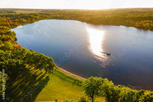 Aerial view of a boat at sunset on a Michigan lake