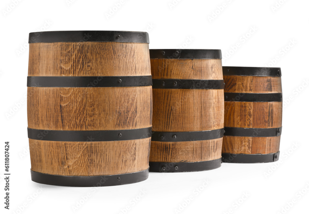 Three traditional wooden barrels on white background Three traditional wooden barrels on white background