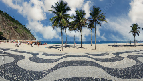 Famous Copacabana beach with black and white mosaic sidewalk in Rio de Janeiro Brazil