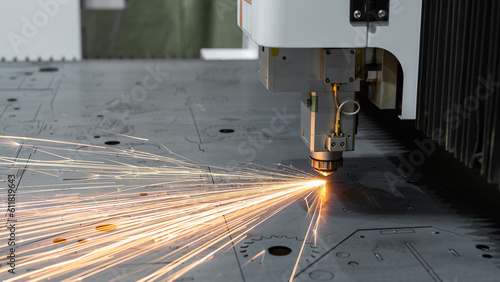 CNC machine. Laser cutting of metal. Sparks.