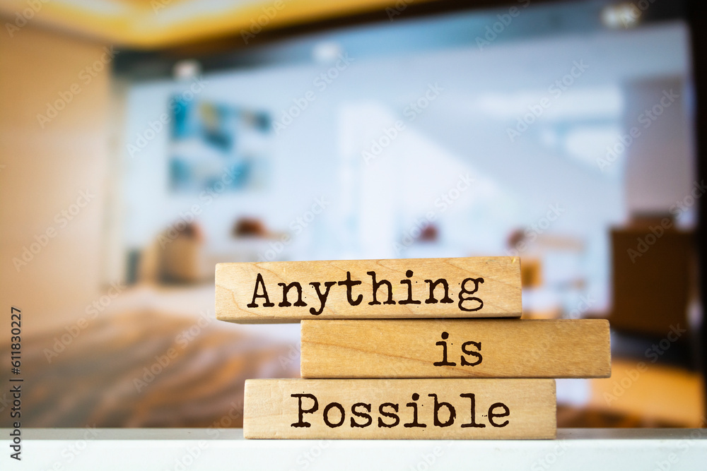 Wooden blocks with words 'Anything is Possible'.