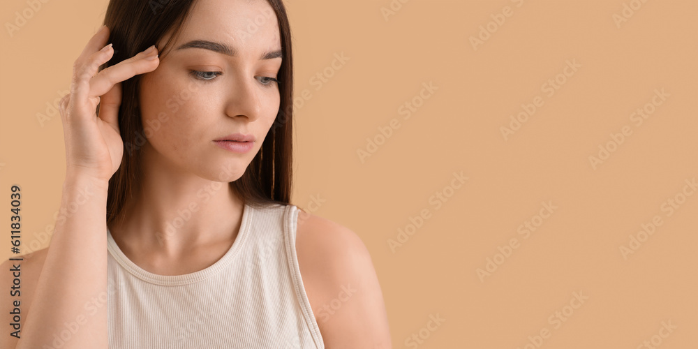 Beautiful woman on beige background with space for text Beautiful woman on beige background with space for text