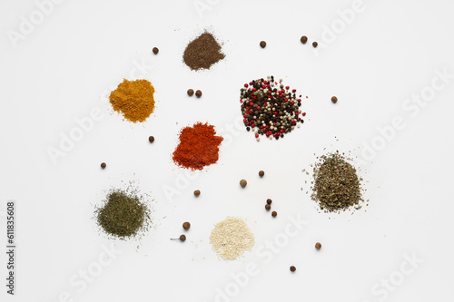 Fototapeta Naklejka Na Ścianę i Meble -  Heaps of fresh aromatic spices on light background