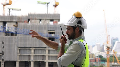 Slow-motion Construction engineer hard working on site of new building construction