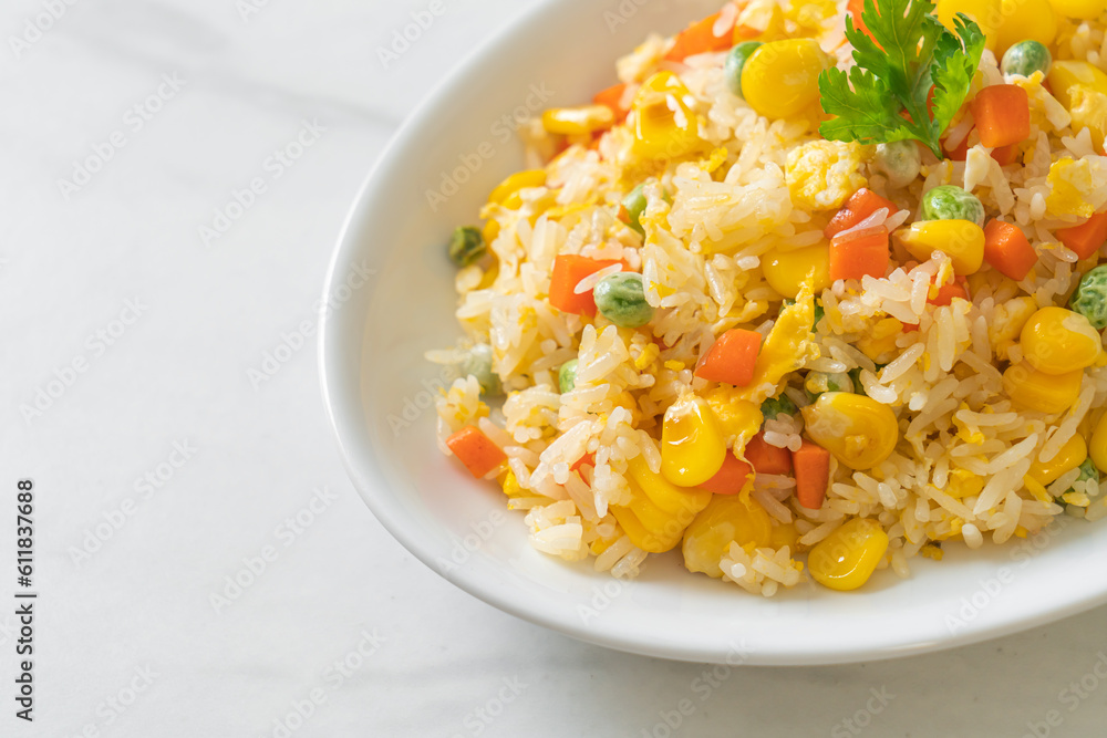fried rice with mixed vegetable (carrot, green bean peas, corn) and egg fried rice with mixed vegetable (carrot, green bean peas, corn) and egg