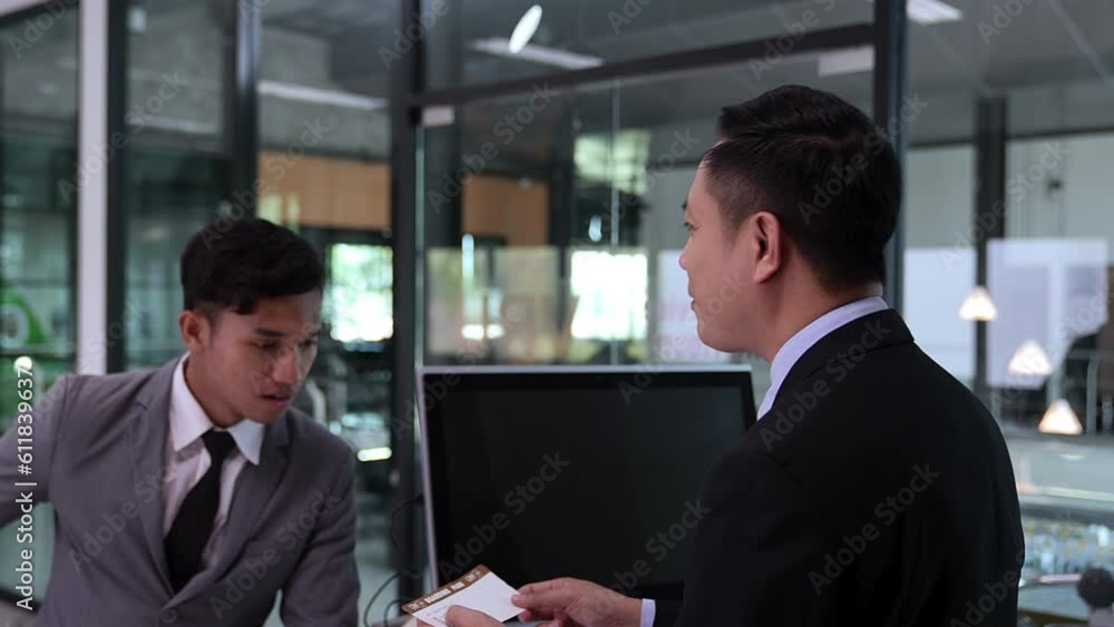 Businessman checking flight with airport staff.Tourist information inquiries. Businessman checking flight with airport staff.Tourist information inquiries.