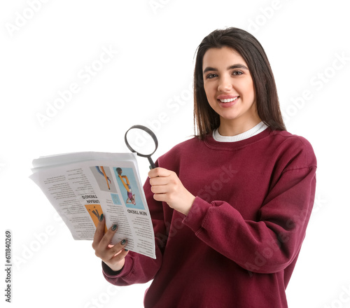 Young woman with magnifier ...