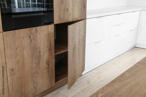 Interior of modern kitchen with wooden drawers