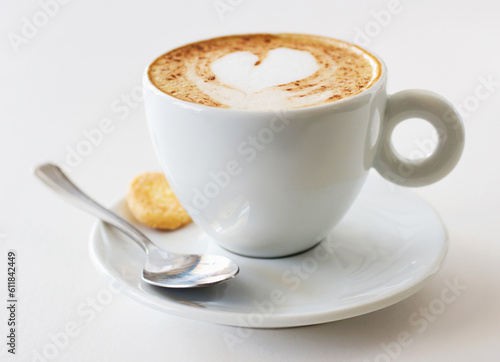Coffee cup, latte and art in restaurant creativity, customer service and hospitality or food industry background. Cafe shop, closeup, espresso drink and inspiration, creative heart design and cream