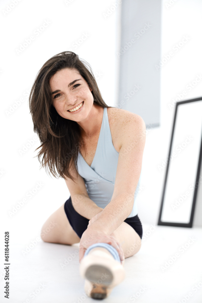 Stretching legs, ballet and portrait of woman training in studio sitting on floor. Ballerina stretch, face and happy athlete from Canada warm up for exercise, dance and fitness, workout and practice. Stretching legs, ballet and portrait of woman training in studio sitting on floor. Ballerina stretch, face and happy athlete from Canada warm up for exercise, dance and fitness, workout and practice.