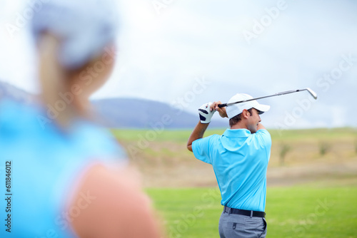 Drive, man or golfer playing golf for fitness, workout or exercise to swing or drive on green course. Woman blur, person golfing or athlete training in action or sports game driving with club stroke