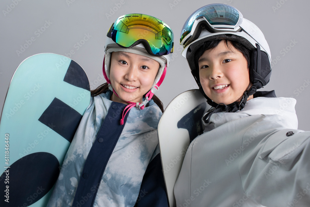 Cheerful girl and boy with snowboards Cheerful girl and boy with snowboards