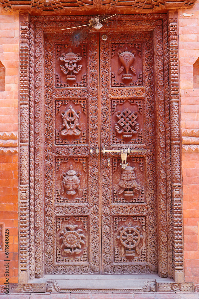 Carved door of a Buddhist temple or monastery in the old city in Bhaktapur, Nepal.
