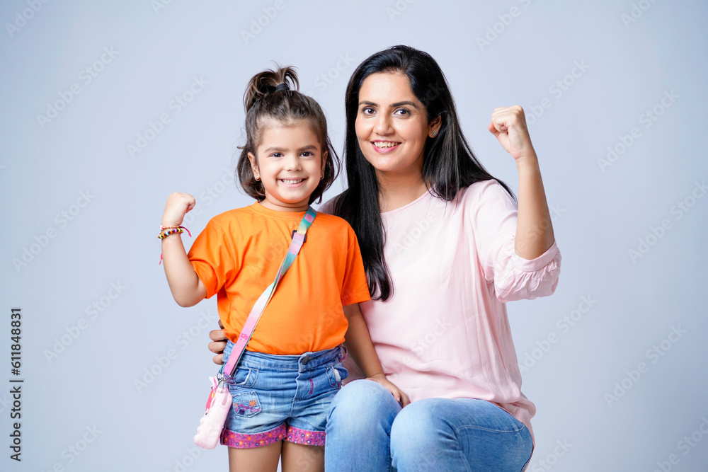 Indian mother with his daughter on white background. - obrazy, fototapety, plakaty 