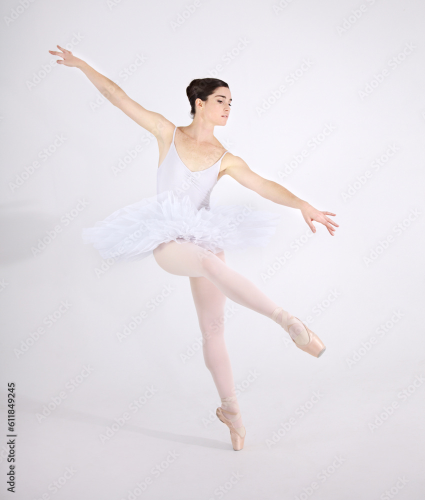 Elegance, dance and ballet with a woman in studio on a white background for rehearsal or recital for theatre performance. Art, creative and balance with a classy young ballerina or dancer in uniform