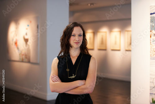 Expert, arms crossed and portrait of a woman at an art gallery for an exhibition. Creative, culture and a museum manager with management of paintings, collection and curator of pictures at a studio photo