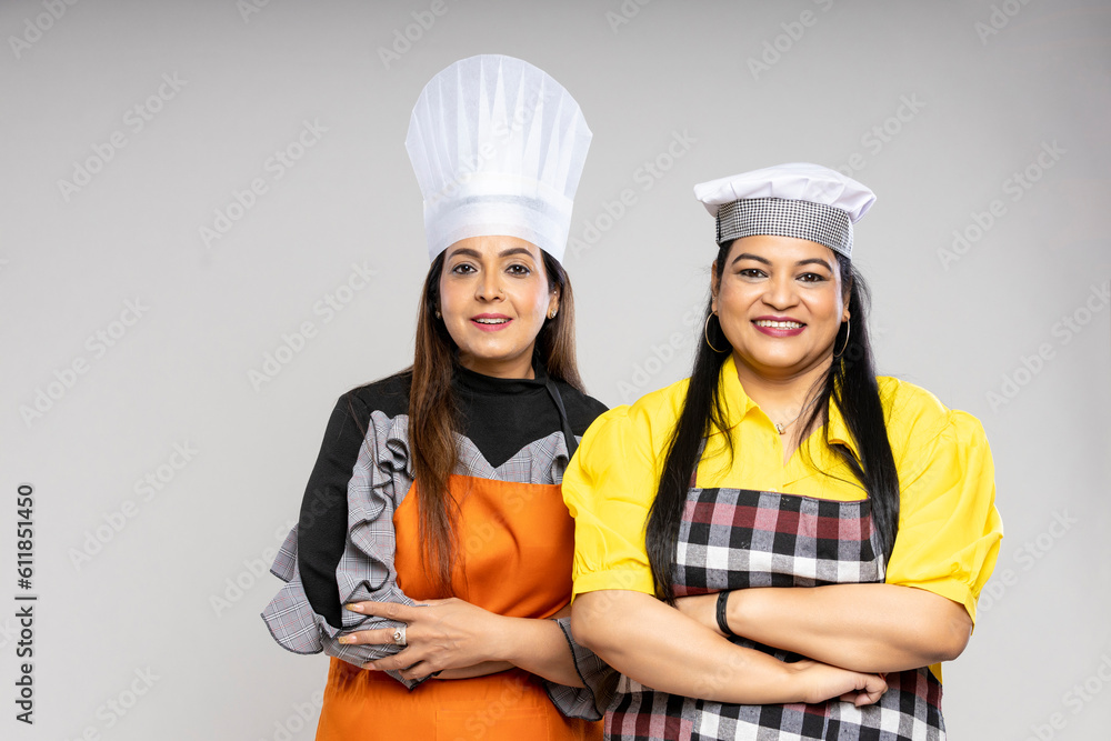 Indian female chef giving happy expression on white background. Indian female chef giving happy expression on white background.
