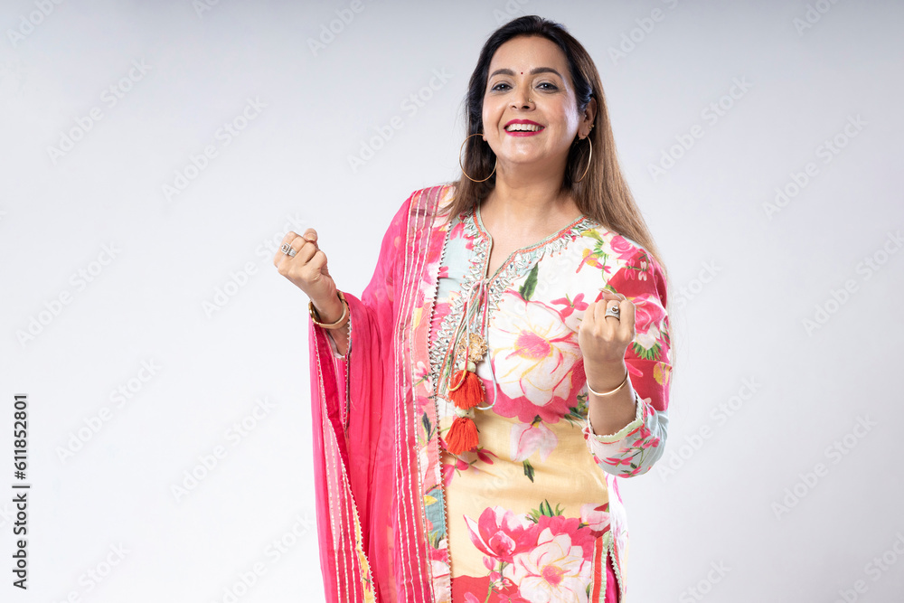 Indian woman smiling and giving happy expression on white background. Indian woman smiling and giving happy expression on white background.