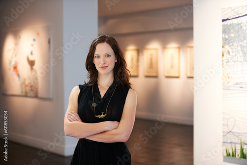 Pride, arms crossed and portrait of a woman at an art gallery for an exhibition. Creative, culture and a museum manager with management of paintings, collection and curator of pictures at a studio photo