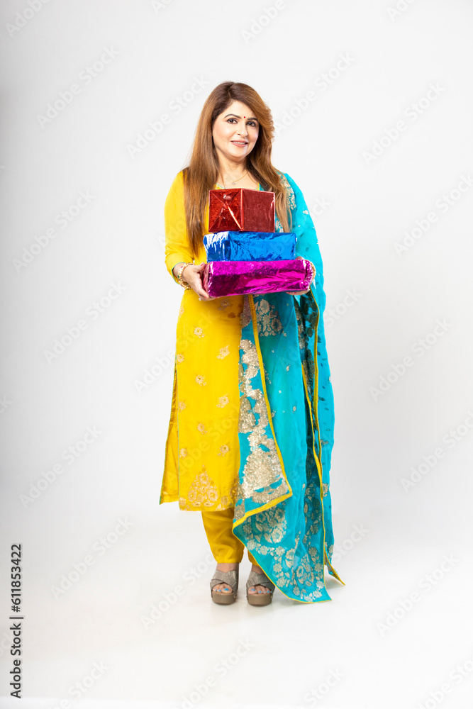 indian women holding gift box on white background. indian women holding gift box on white background.