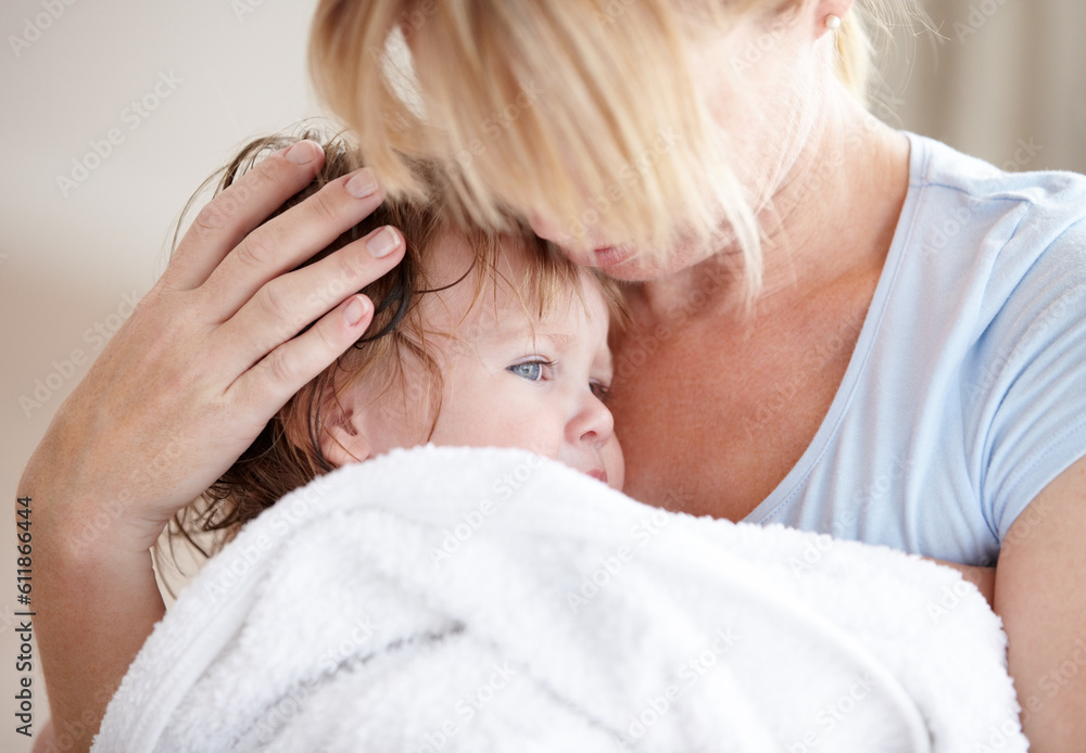 Hug, love and a mother with a child after a bath for heat, care and cuddling. Family, comfort and a mom holding a baby after a wash, hugging and embracing for closeness, bonding and affection Hug, love and a mother with a child after a bath for heat, care and cuddling. Family, comfort and a mom holding a baby after a wash, hugging and embracing for closeness, bonding and affection