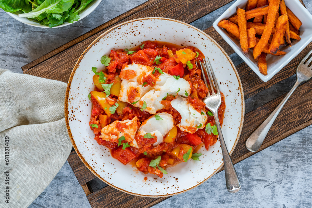 Sicilian fish with pepper sauce and sweet potato chips Sicilian fish with pepper sauce and sweet potato chips