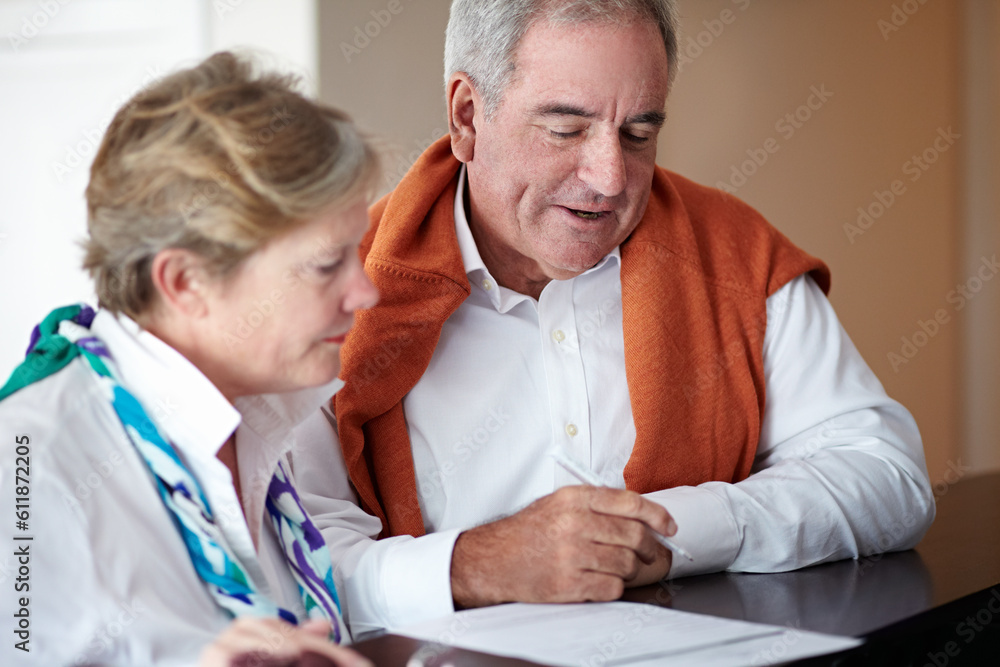 Obraz premium Information, reception desk and happy couple for hospitality, customer service and tourism vacation or holiday. Mature people writing signature, booking or registration, hotel or travel agency advice