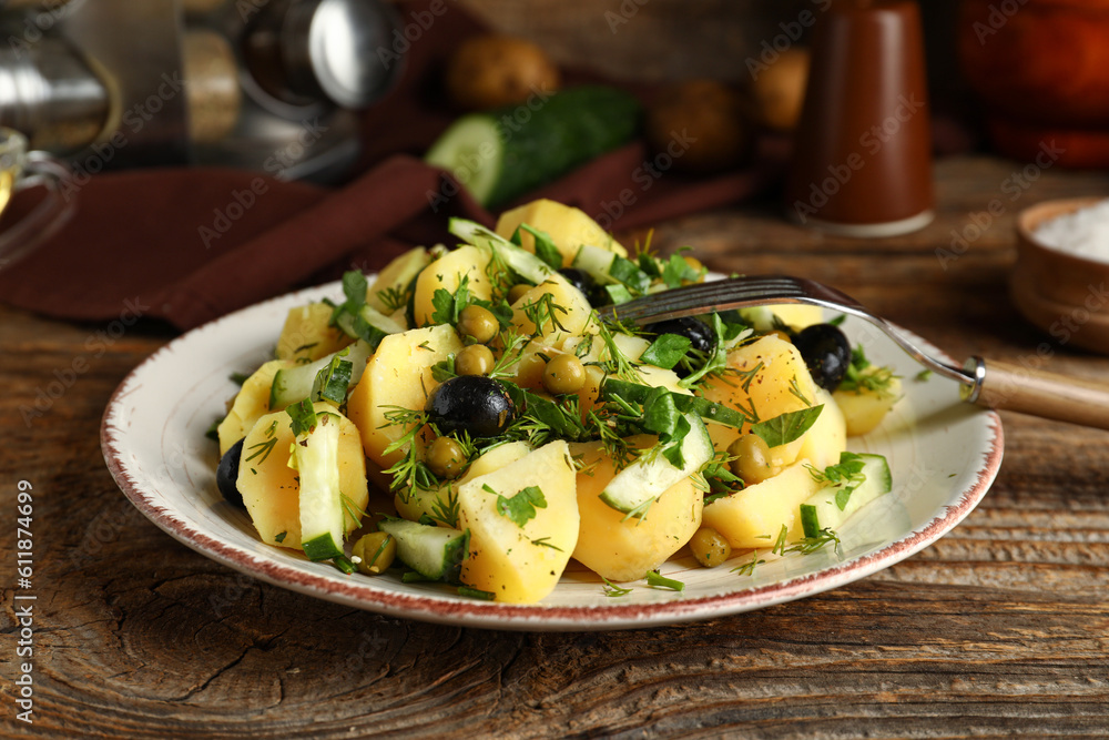 Plate of tasty Potato Salad with vegetables on wooden background Plate of tasty Potato Salad with vegetables on wooden background