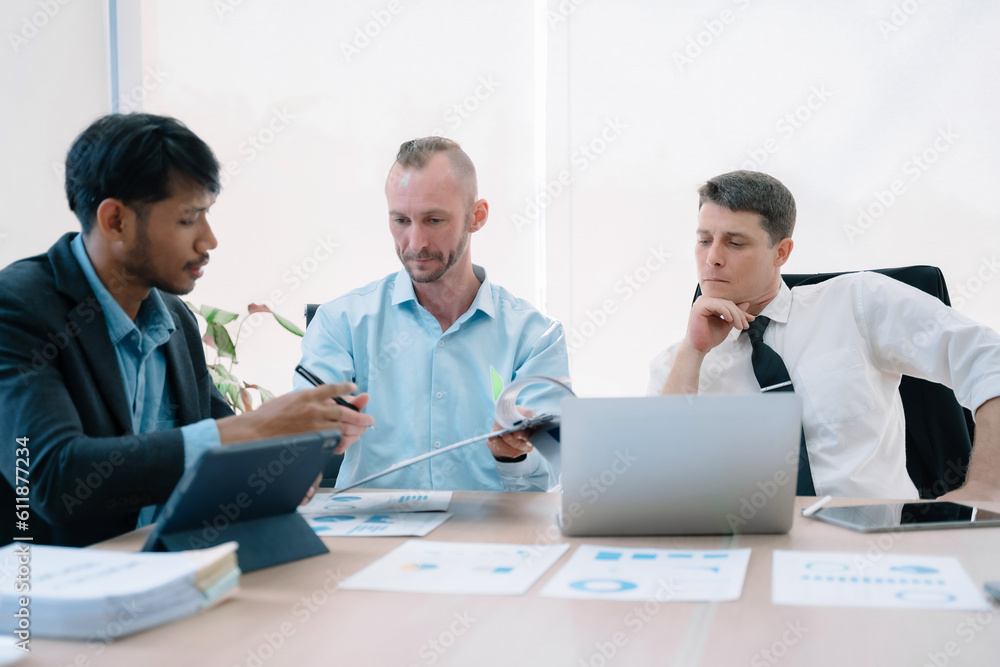 Group of diverse business people discussing a project in a meeting for analysis graph company financial. Group of diverse business people discussing a project in a meeting for analysis graph company financial.