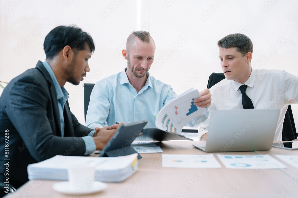 Group of diverse business people discussing a project in a meeting for analysis graph company financial. Group of diverse business people discussing a project in a meeting for analysis graph company financial.