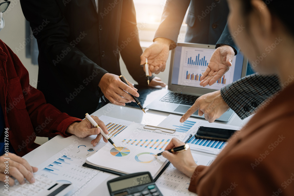 Businessmen team or financial data analysts working with tablets and laptop computers and data graphs together. Plan to analyzing projects in the office. Businessmen team or financial data analysts working with tablets and laptop computers and data graphs together. Plan to analyzing projects in the office.