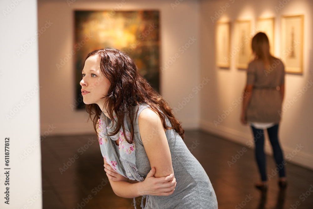 Fototapeta premium Gallery, woman and studying art at exhibition, museum or creative painting on a wall for a show in artist studio. Study, thinking and girl with focus on abstract paintings, culture or artwork buyer