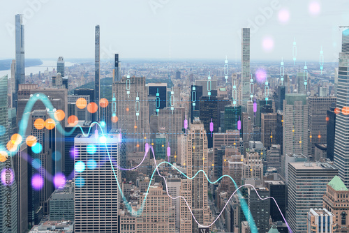 Aerial panoramic city view of Upper Manhattan and Central Park, New York city, USA. Iconic skyscrapers of NYC. Forex candlestick graph hologram. The concept of internet trading, brokerage, analysis