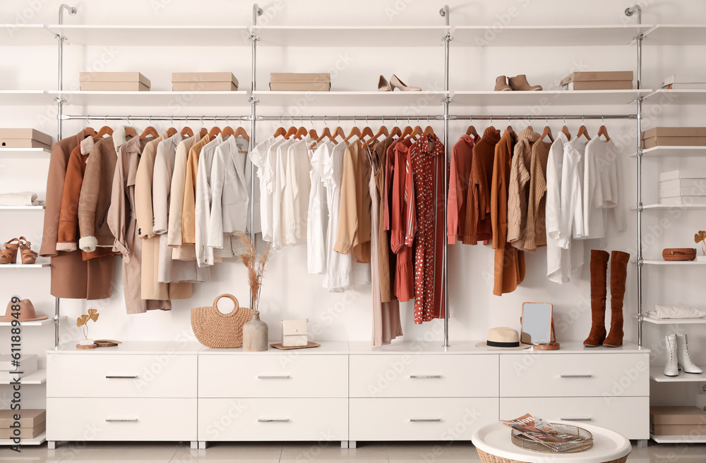 Stylish clothes with shoes and accessories in boutique Stylish clothes with shoes and accessories in boutique