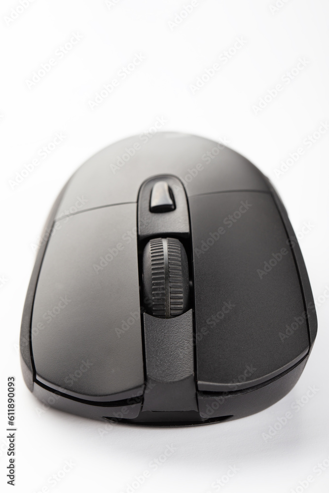 Black wireless computer mouse on a white background. Black wireless computer mouse on a white background.