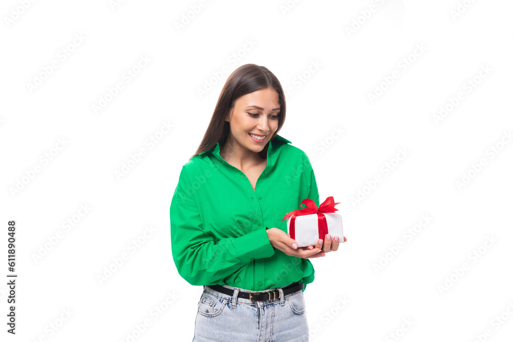 cute young brown-eyed brown-haired woman with makeup in a green blouse decides to prepare a gift for her boyfriend's holiday cute young brown-eyed brown-haired woman with makeup in a green blouse decides to prepare a gift for her boyfriend's holiday