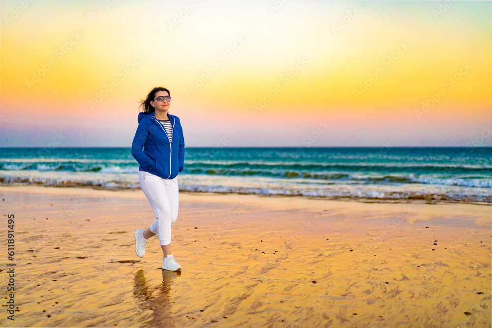 Beautiful woman walking on beach
Beautiful woman walking on beach