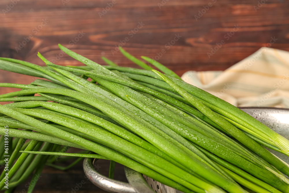 Fresh green onion on wooden background, closeup Fresh green onion on wooden background, closeup