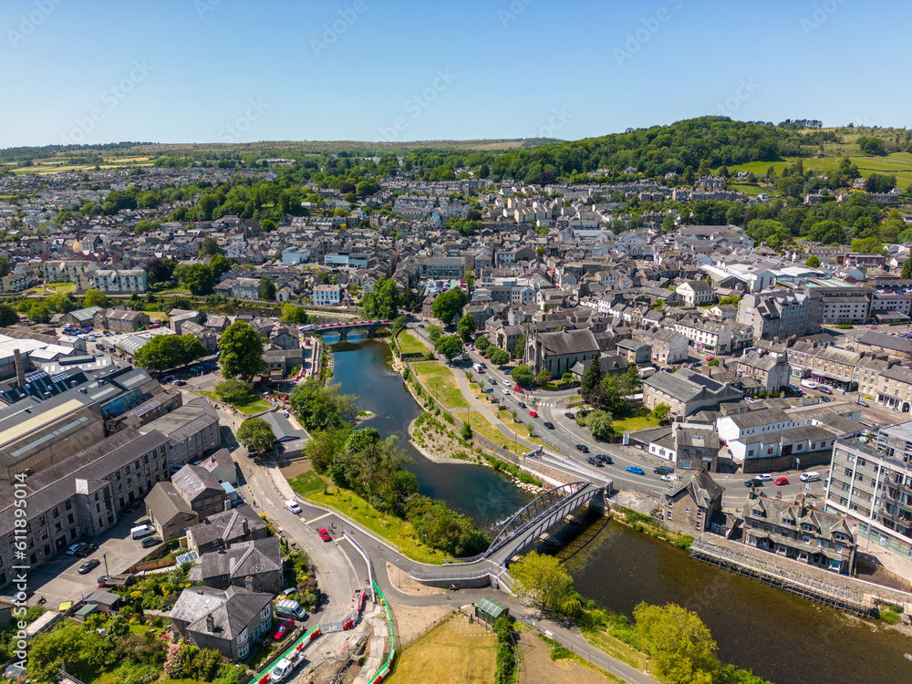 This aerial drone photo shows the large town of Kendal. The river Kent is going through the town center and makes it a really nice place. Kendal is located in the province of Cumbria in North England.