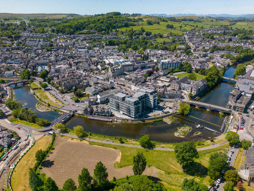 This aerial drone photo shows the large town of Kendal. The river Kent is going through the town center and makes it a really nice place. Kendal is located in the province of Cumbria in North England.