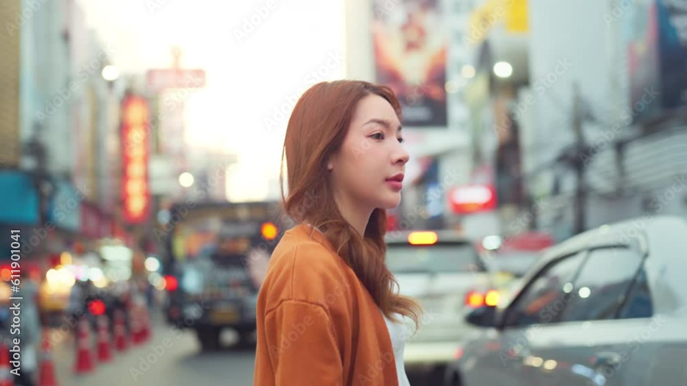 Side view - Happy young tourist asian woman walking in the street Chinatown Bangkok urban city, Female shopping and eating street food on summer holiday vacation, Slow motion Side view - Happy young tourist asian woman walking in the street Chinatown Bangkok urban city, Female shopping and eating street food on summer holiday vacation, Slow motion