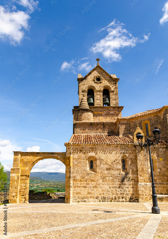 Beautiful bell tower and archway in Frias castle - fortress in Spain. Ancient gothic castle garrison of the town below. Park with a tree