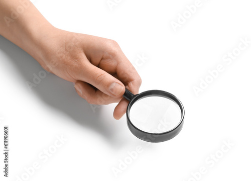 Female hand with mini magnifier isolated on white background