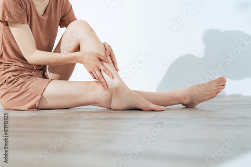 Close-up of a woman doing leg skin care. Body care. Self treatment. photo