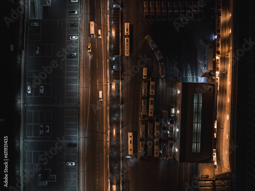Top view of car traffic transport on crossing multiple lanes highway or expressway in Asia city at night. Civil engineering, technology background, Asian transportation concept
